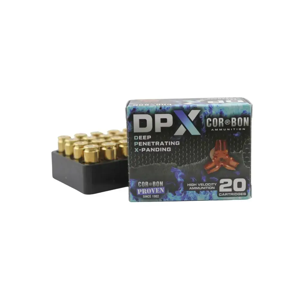 Box of DPX Cor Bon ammunition with 20 cartridges and a tray of brass casings beside it — high-velocity, deep-penetrating rounds
