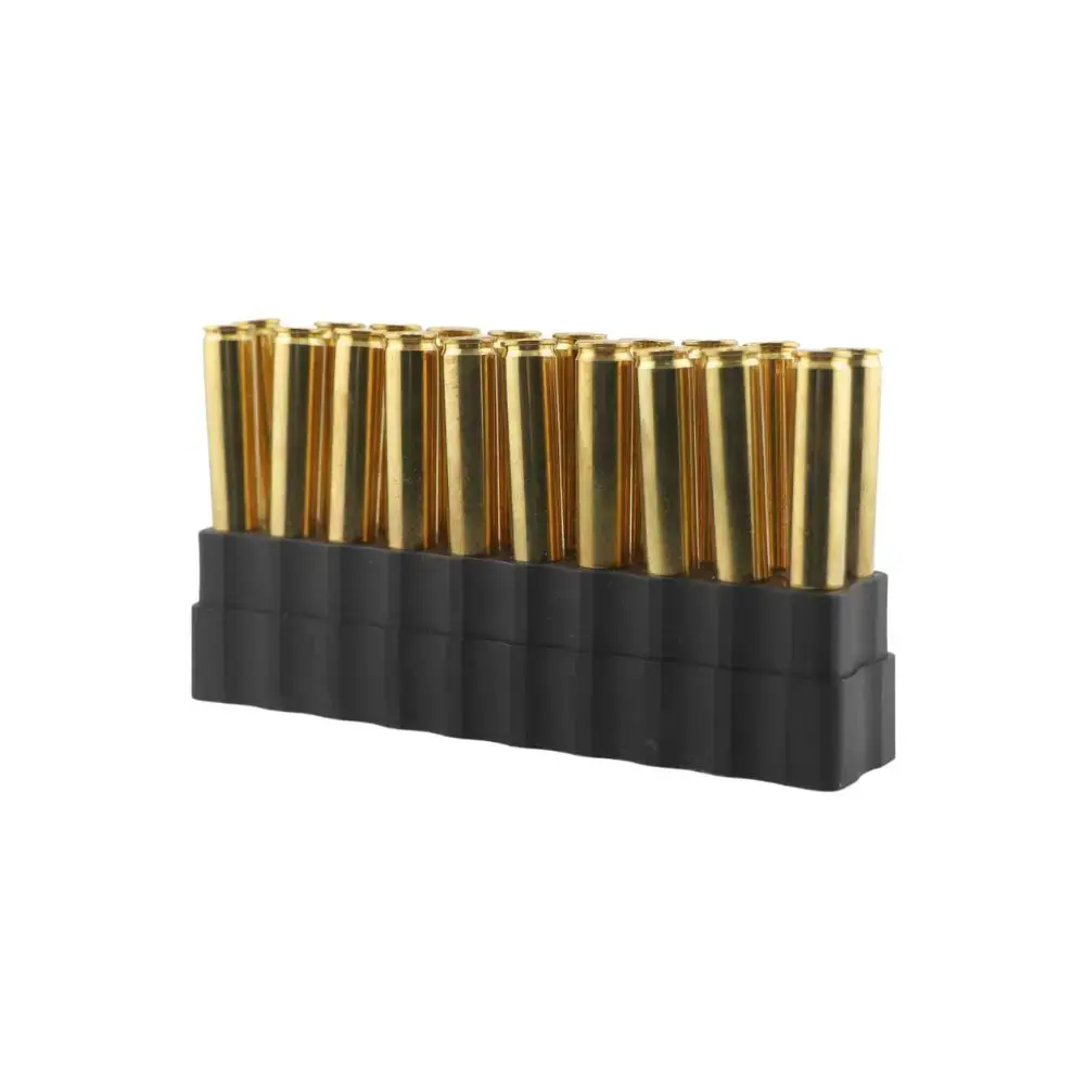 Row of brass handgun cartridges standing upright in a black plastic holder, arranged in a neat row
