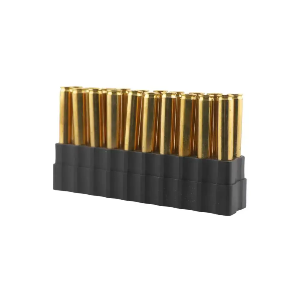 Row of brass ammunition cartridges standing upright in a black plastic holder.