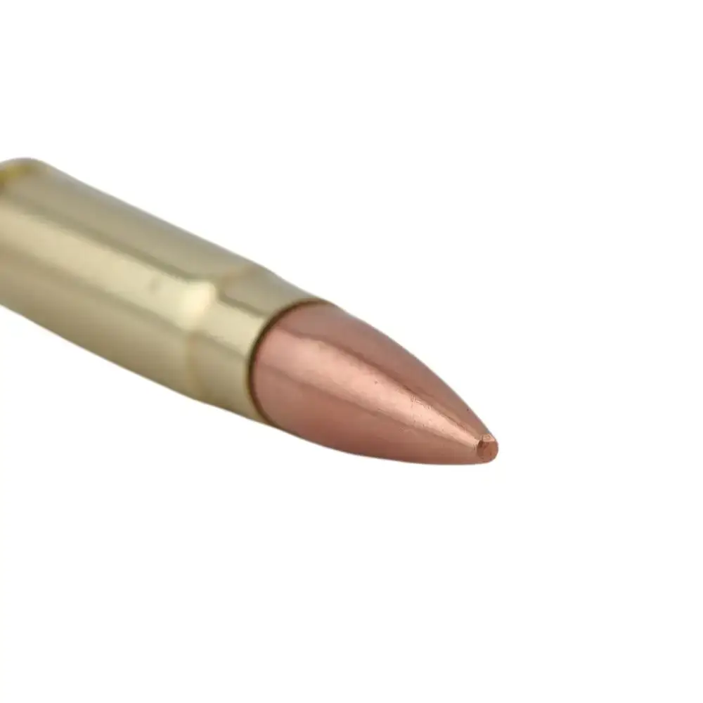 Close-up of a brass cartridge with a copper-colored jacketed bullet.