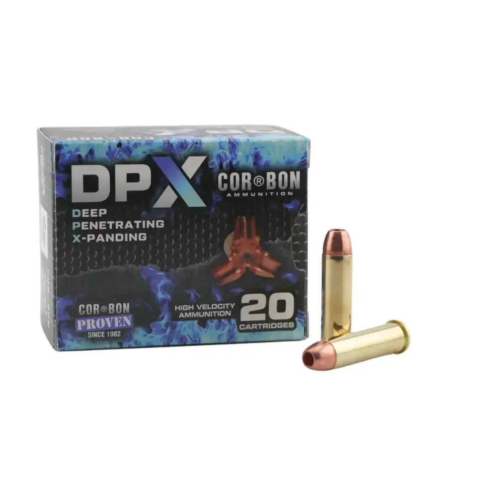 Box of DPX Cor-Bon ammunition labeled Deep Penetrating X-Panding, 20 cartridges, with two brass-cased bullets shown beside the box