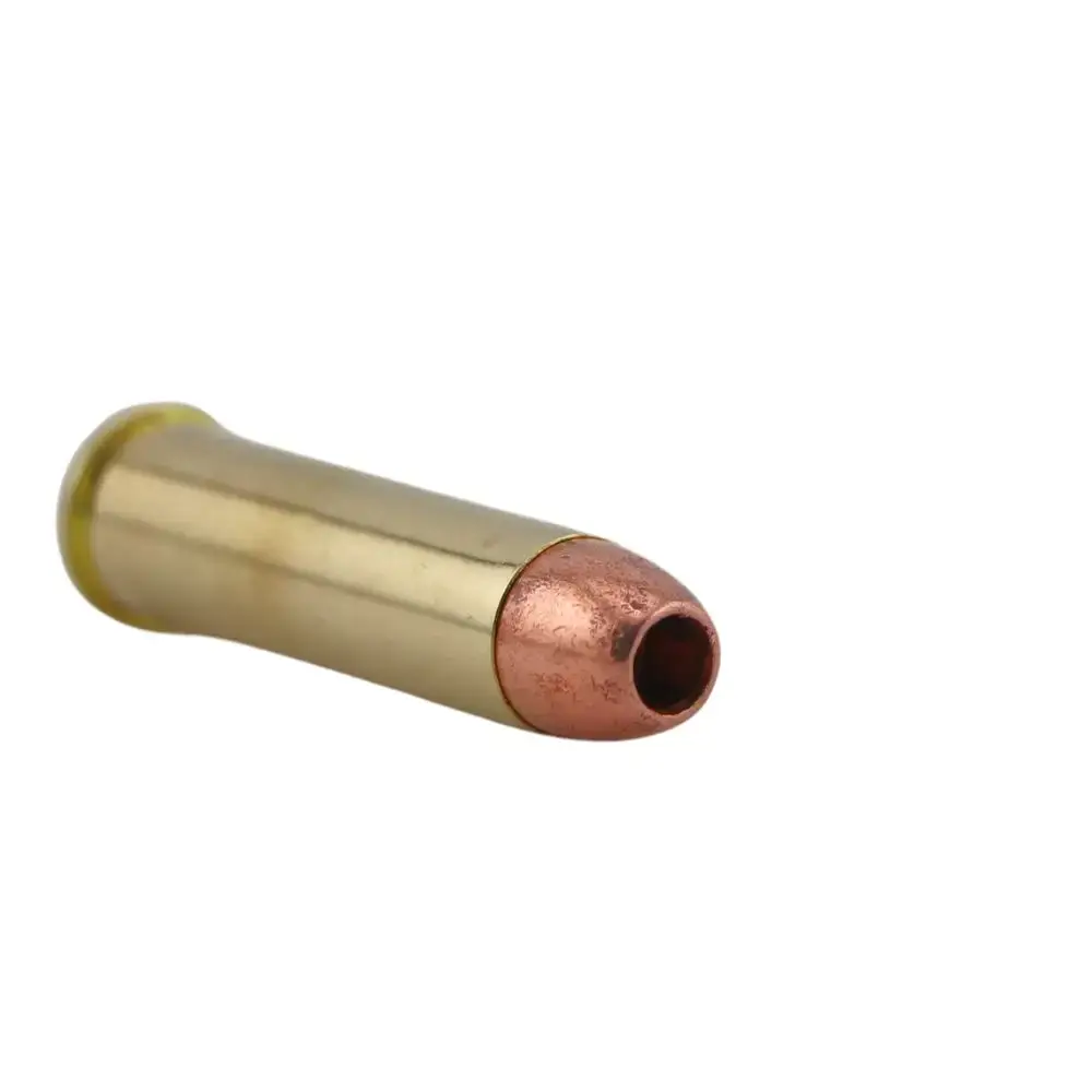 Close-up of a brass cartridge case with a copper bullet at the open neck edge.