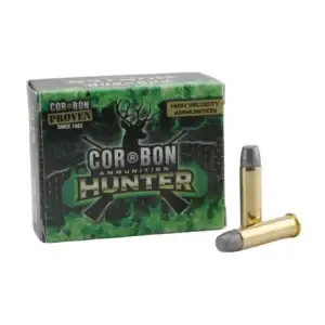 Cor-Bon Hunter high-velocity ammunition box with two brass cartridges beside it on a white background