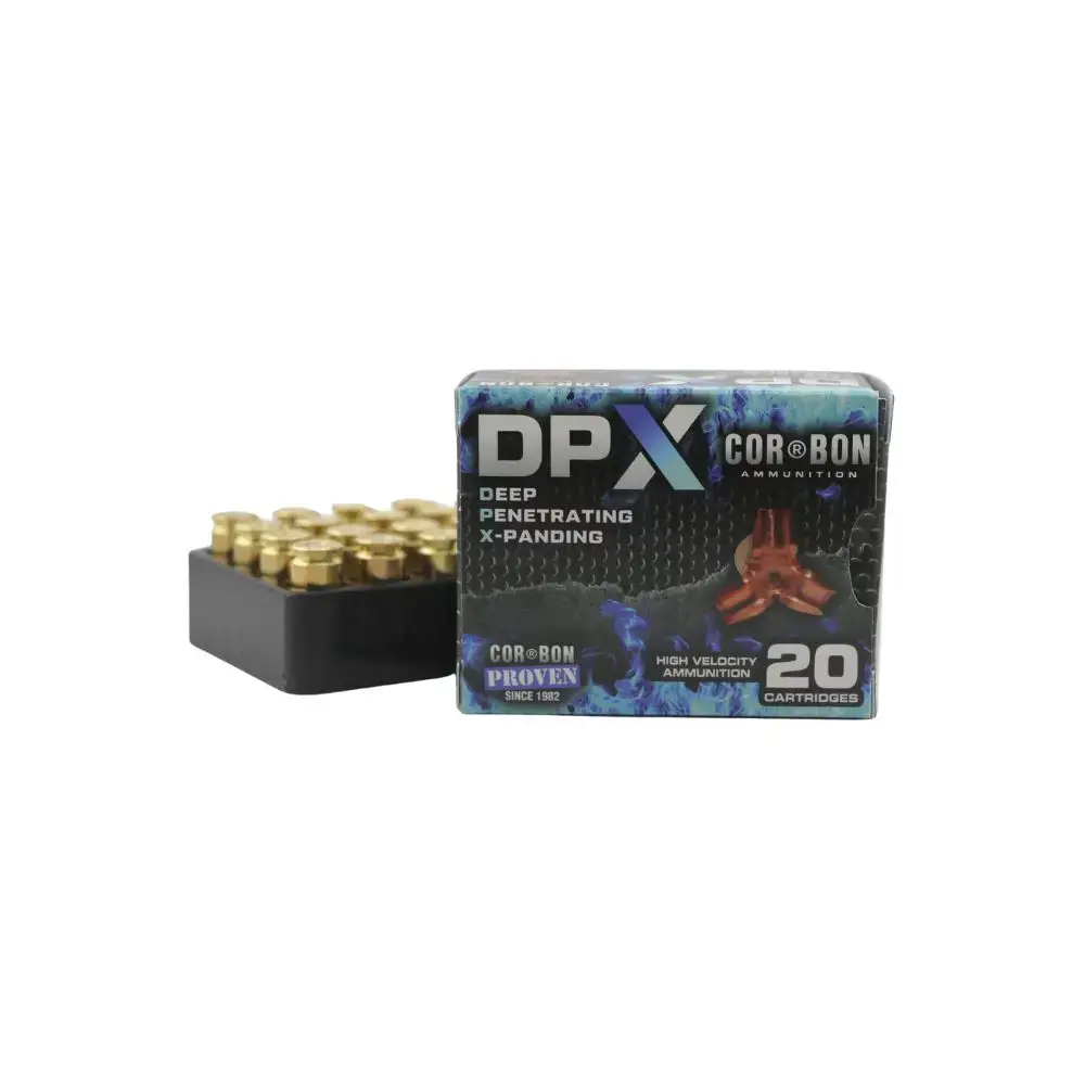 Box of DPX Cor® BON ammunition labeled 'Deep Penetrating X-Panding' containing 20 cartridges, with a surrounding black ammo tray nearby