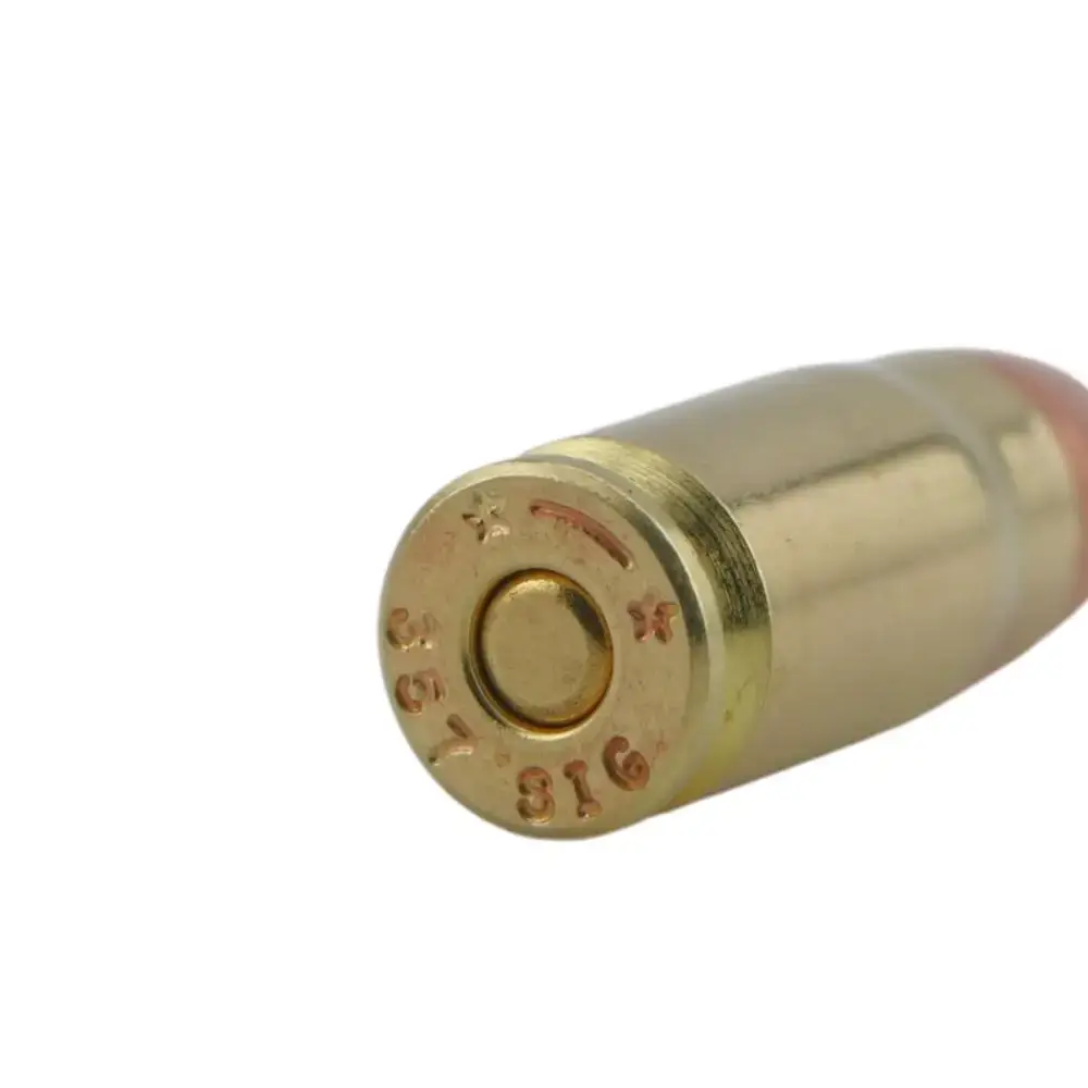 Close-up of a brass ammunition cartridge base showing the primer and stamped headmark (caliber markings visible)