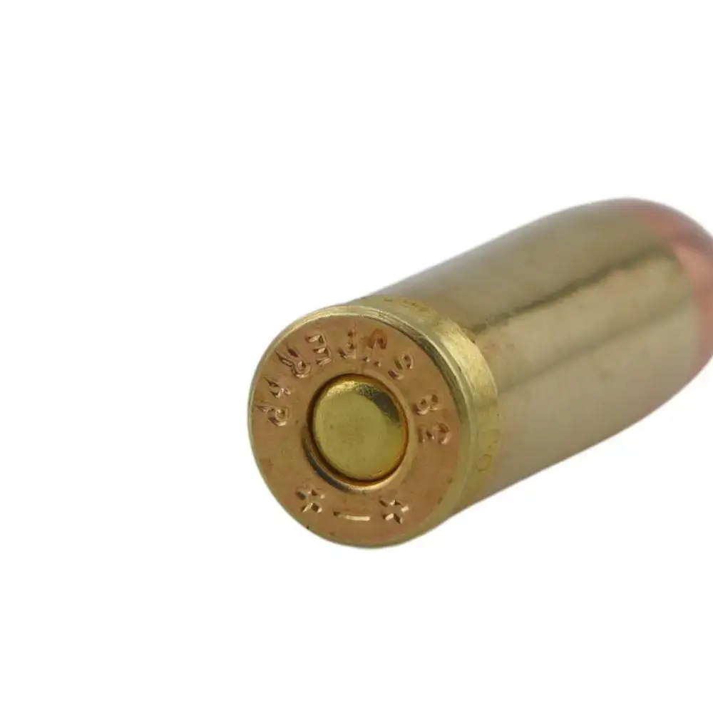 Close-up of a spent brass cartridge casing with the primer visible on a white background