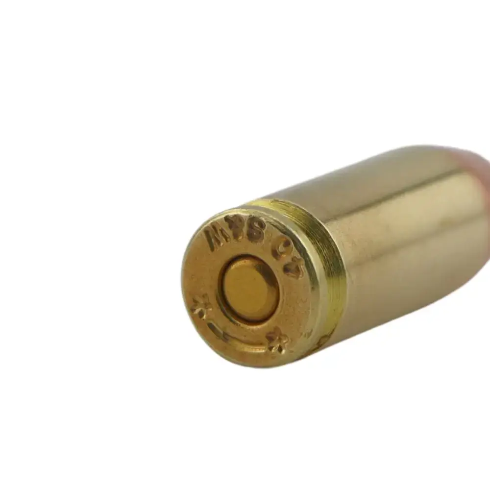 Close-up of a brass firearm cartridge case with the primer at the base facing the viewer.