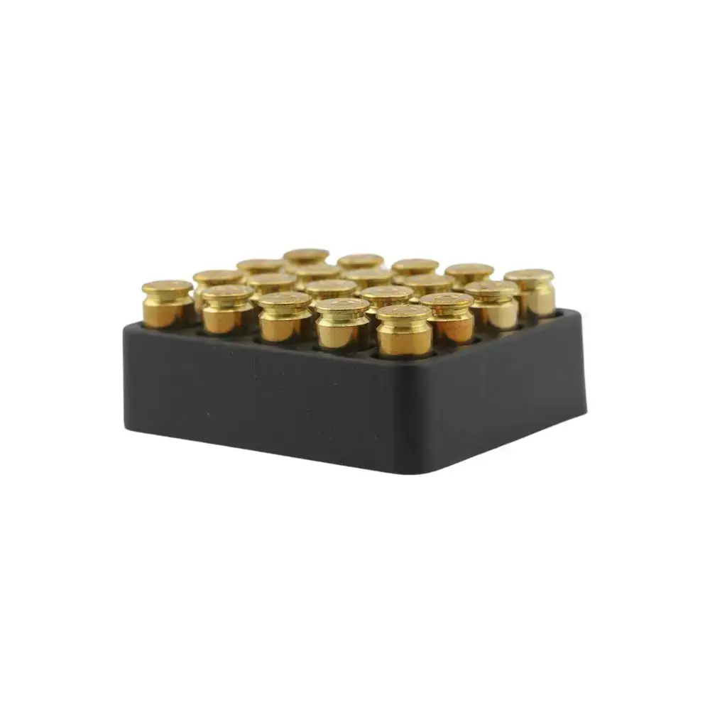 Black LEGO-style brick with a grid of gold studs on top, viewed at slight angle.