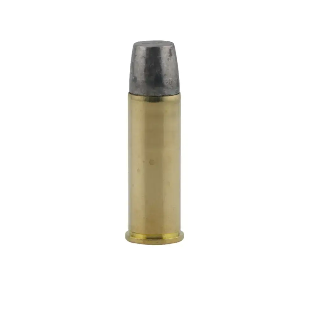 Brass rifle cartridge standing upright with a dull silver bullet tip