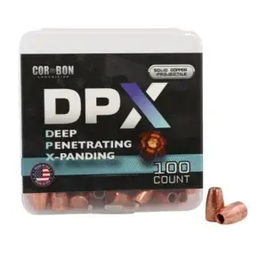 Box of Cor-Bon DPX copper hunting ammo, 100 rounds, with three copper bullets resting beside the container.