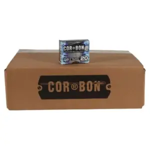 Large brown cardboard shipping box with a smaller COR-BON ammunition box perched on top (20 cartridges).